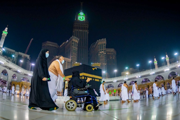 A handout picture provided by the Saudi Ministry of Hajj and Umrah on October 4, 2020, shows Saudis and foreign residents walking around the Kaaba (Tawaf) in the Grand Mosque complex in the holy city of Mecca [File: Saudi Ministry of Hajj and Umra via AFP]