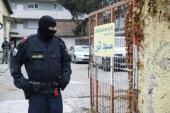 A police officer stands guard in front of a Muslim cultural centre and mosque in Graz which was raided in a police operation on November 9, 2020 [File: AFP/Erwin Scheriau]