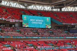A screen sends Best Wishes to Danish national soccer player Christian Eriksen before the UEFA EURO 2020 group D preliminary round soccer match between England and Croatia in London, Britain, 13 June 2021. Eriksen collapsed on the pitch during the UEFA EURO 2020 match between Denmark and Finland on 12 June 2021 and received medical treatment before being stretchered off to a hospital [EPA-EFE/Justin Tallis]