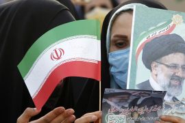 Women supporters of Iranian presidential candidate Ebrahim Raisi hold pictures depicting him, during an election campaign rally in Tehran, Iran, 16 June 2021.