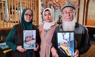 Marhaba Yakub Salay, centre, with her parents Bahar Mamtimin, left, and Yakub Sabir, right, holding a photograph of sister and daughter Mayila Yakufu who they say is currently detained by the Chinese government. Australian Uighurs told Al Jazeera they have been unable to contact family members in China for years [Courtesy of Marhaba Yakub Salay]