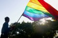 Taiwanese LGBT rights activist waves a rainbow flag