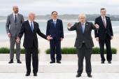 US President Joe Biden, Britain&#39;s Prime Minister Boris Johnson, European Council President Charles Michel, Japan&#39;s Prime Minister Yoshihide Suga and Italy&#39;s Prime Minister Mario Draghi stand for a family photo during the G7 summit in Carbis Bay, Cornwall, Britain, June 11, 2021 [Kevin Lamarque/Reuters]