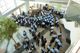 Police officers arriving at the office of Next Media, publisher of Apple Daily, in Hong Kong, China, 17 June 2021.