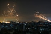 The Israeli Iron Dome missile defence system intercepts rockets fired by the Hamas movement towards southern Israel from Gaza on May 14, 2021 [File: AFP/Anas Baba]