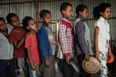 Children, who fled the violence in Ethiopia&#39;s Tigray region, wait in line for breakfast organised by a volunteer, in Mekelle, the capital of Tigray region, on June 23, 2021 [File: Yasuyoshi Chiba/AFP]