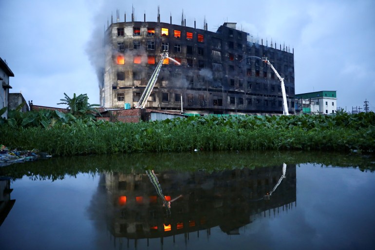 Flames rise the morning after a fire broke out at a factory in Rupganj of Narayanganj district, on the outskirts of Dhaka [Mohammad Ponir Hossain/Reuters]