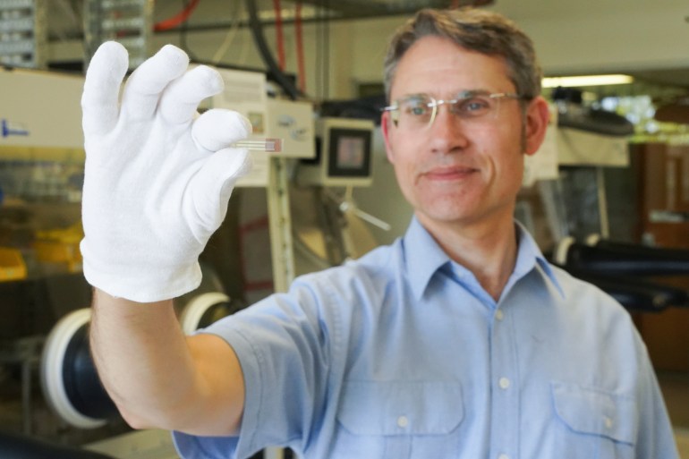 Professor of Physics Paul Dastoor holds up a non-invasive, printable saliva test strip for diabetics at the University of Newcastle, New South Wales, Australia [Courtesy of University of Newcastle via Reuters]