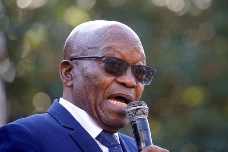 In this file photo from May 2021, South African former President Jacob Zuma speaks to supporters after appearing at the High Court in Pietermaritzburg [File: Rogan Ward/Reuters]
