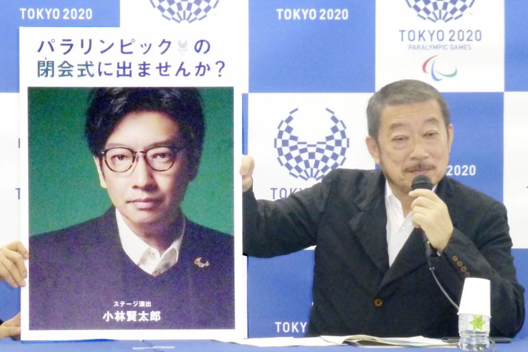 Hiroshi Sasaki, Tokyo 2020 Paralympic Games executive creative director, displays a portrait of Olympics opening ceremony show director Kentaro Kobayashi during a news conference in Tokyo, Japan, in this photo taken by Kyodo December 2019.