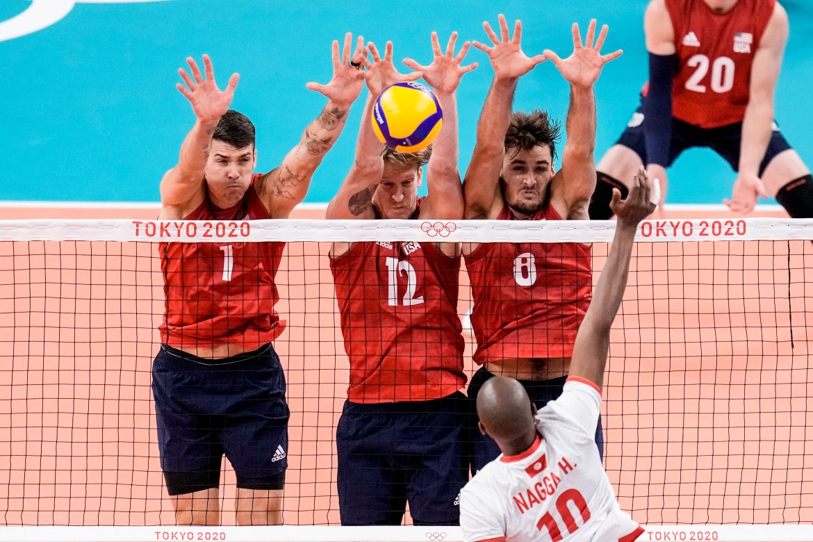 Tunisia's Hamza Nagga spikes the ball during a men's volleyball preliminary round Pool B match between the United States and Tunisia. [Manu Fernandez/AP Photo]