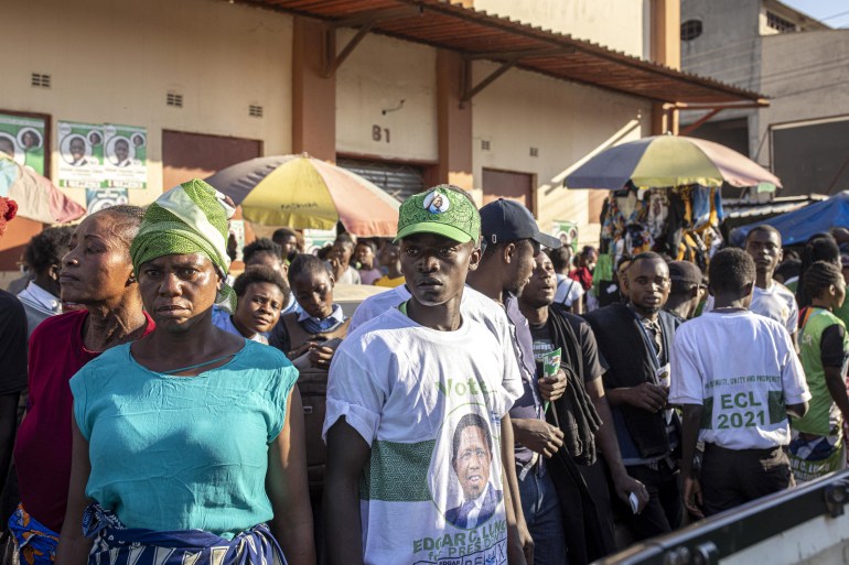 Supporters of the ruling Patriotic Front of incumbent President Edgar Lungu gather during a campaign parade in Lusaka [Patrick Meinhardt / AFP]