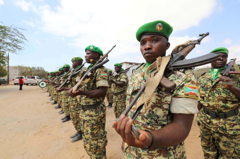Burundian African Union Mission in Somalia peacekeepers stand in formation