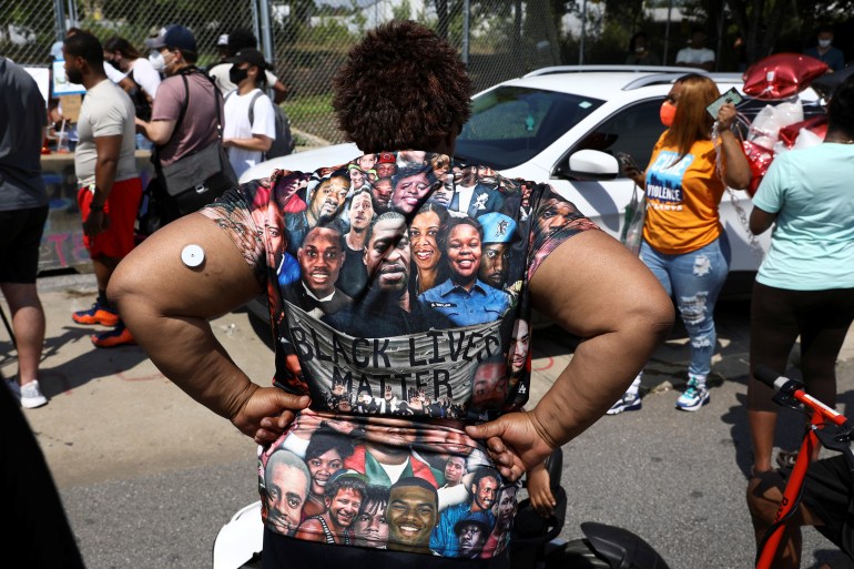A woman wears a Black Lives Matter T-shirt during a rally for racial justice on the one-year anniversary of the police shooting of Rayshard Brooks, in Atlanta, Georgia, the United States [File: Dustin Chambers/Reuters]