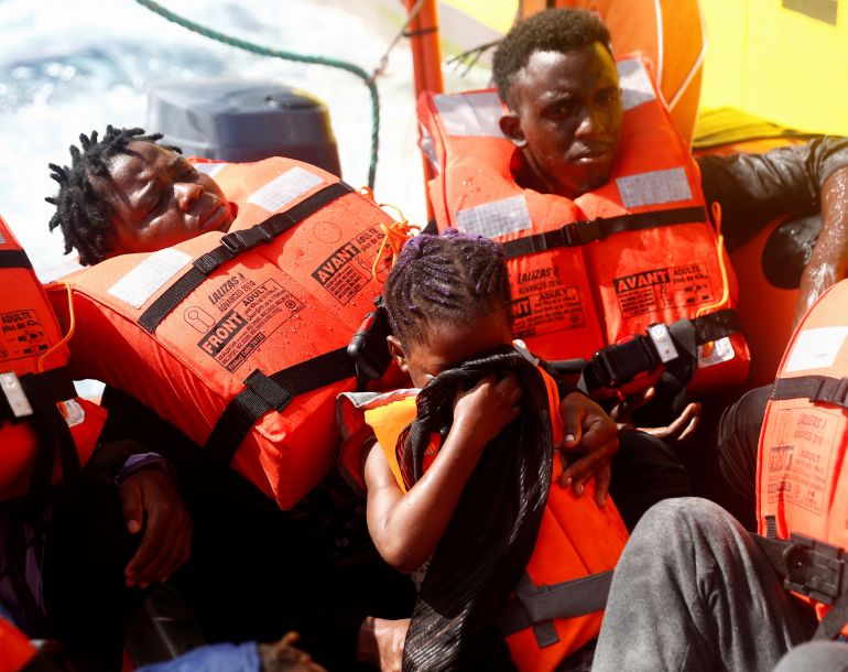Migrants in life vests 