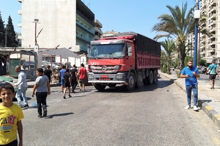 A truck blocks a road in Tripoli, Lebanon after the central bank decided to effectively end subsidies on fuel imports [Walid Saleh/Reuters]