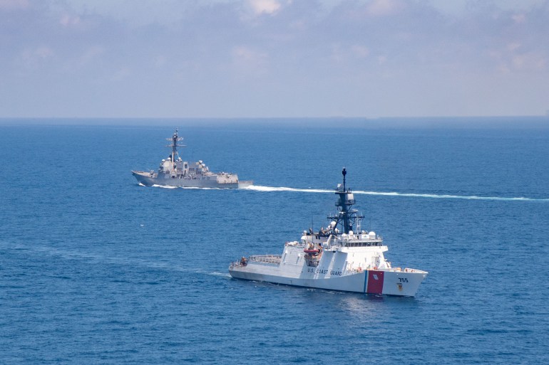 The Arleigh Burke-class guided-missile destroyer USS Kidd and U.S. Coast Guard cutter Munro conduct Taiwan Strait transits August 27, 2021. Picture taken August 27, 2021. U.S. Navy/Handout via REUTERS THIS IMAGE HAS BEEN SUPPLIED BY A THIRD PARTY.