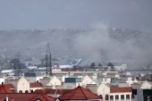 Smoke rises from explosion outside the airport in Kabul on August 26, 2021 [AP/Wali Sabawoon]