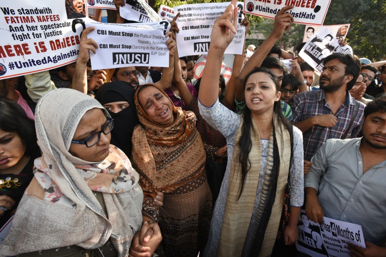 A wailing Fatima Nafees with JNU students protesting outside the CBI headquarters in New Delhi over Najeeb Ahmed's disappearance [File: Raj K Raj/Hindustan Times via Getty Images]