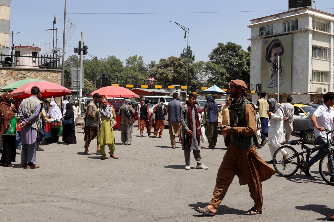 Afghan workers rush home after news broke that the Taliban had reached the outskirts of Kabul. [EPA]