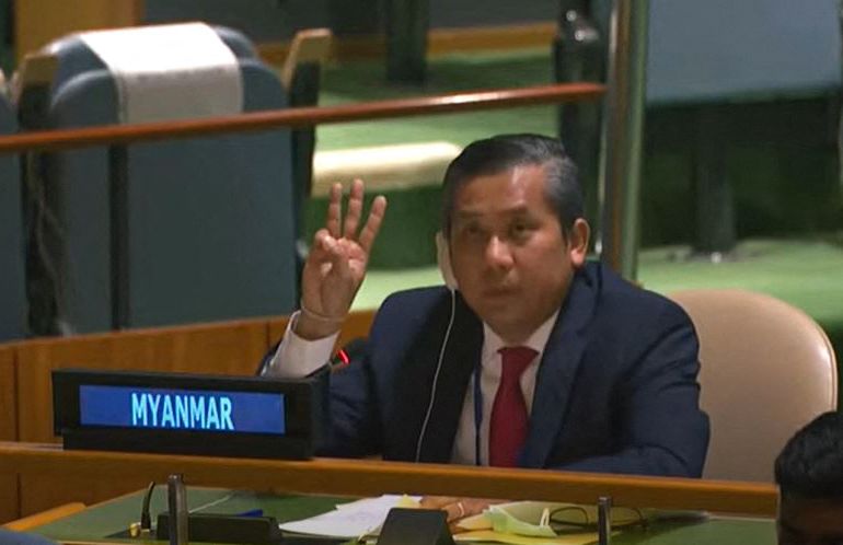 Diplomat Moe Kyaw Tun making the three fingered salute of Myanmar's anti-coup movement at a UN meeting five days after the military seized power. He is sitting at the Myanmar desk in the UN General Assembly