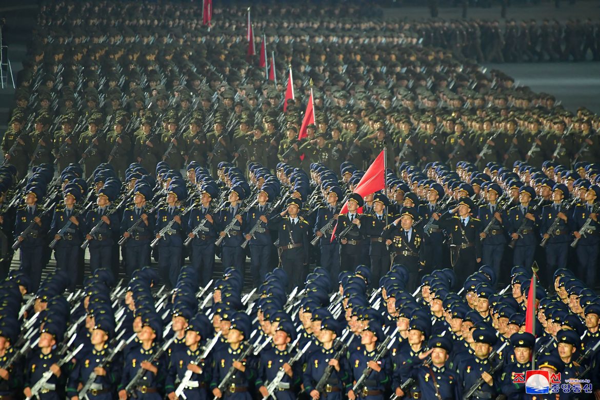 North Korean troops march in a mass parade to mark the country's founding