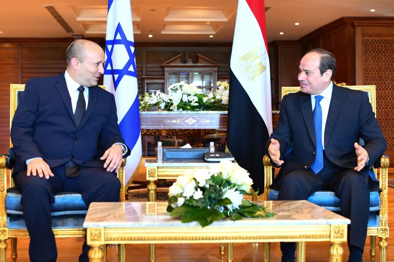 A handout picture released by the Egyptian Presidency on September 13, 2021, shows Egyptian President Abdel Fattah al-Sisi (R) meeting with Israeli Prime Minister Naftali Bennett