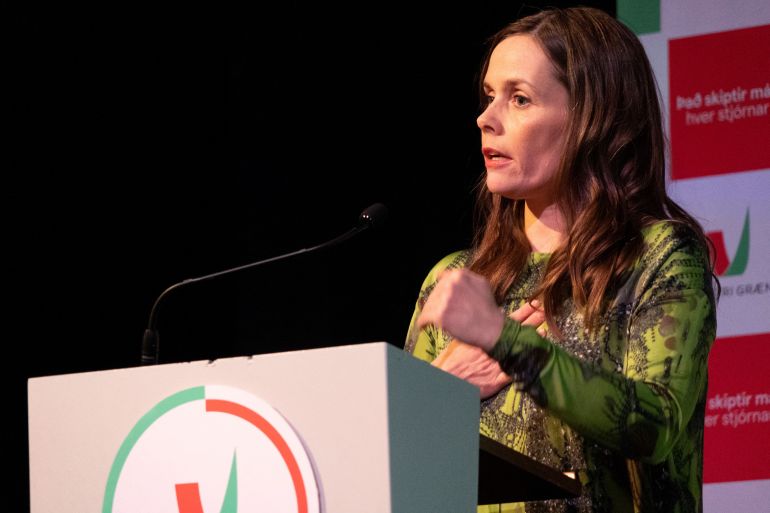 Icelandic Prime Minister Katrin Jakobsdottir talks to supporters of her Left Green Movement at a party event in Reykjavik on September 25, 2021