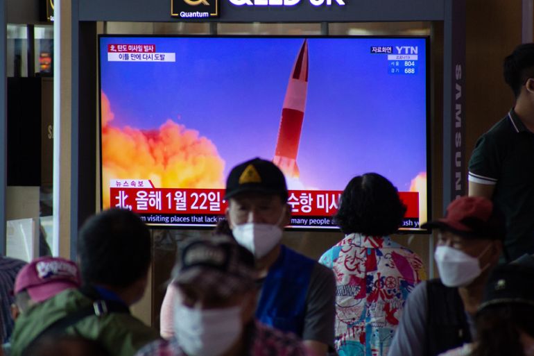 People watch a television showing breaking news at station in Seoul, South Korea, 15 September 2021.