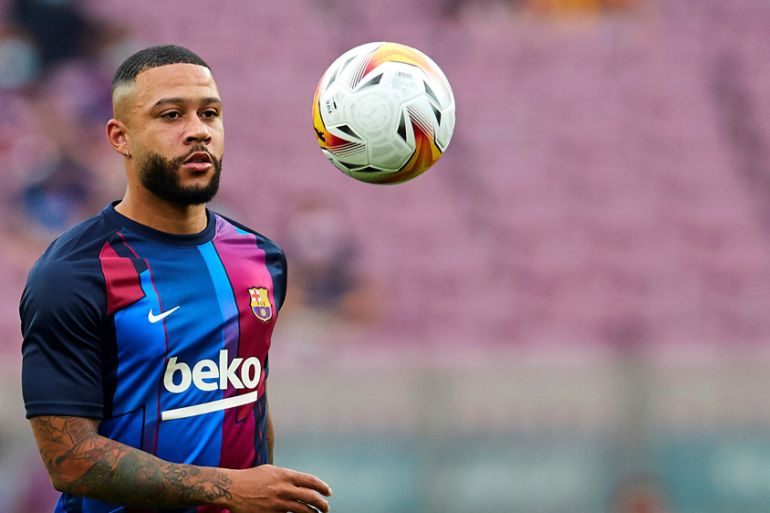 Barcelona's striker Memphis Depay warms up ahead of a Spanish LaLiga soccer match between FC Barcelona and Real Sociedad at Camp Nou in Barcelona, Spain, 15 August 2021