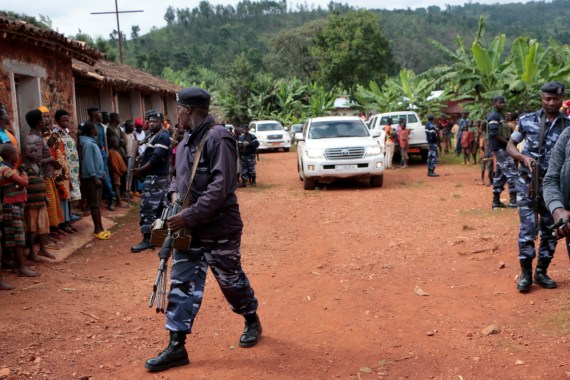 Burundian police officers escort the opposition leader and presidential candidate Agathon Rwasa