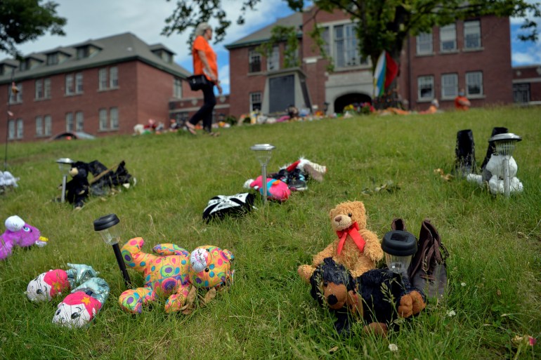 Stuffed animals are left at the site of a former residential school in Canada