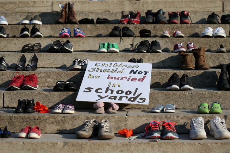 Shoes sit on the steps of the provincial legislature to symbolise Indigenous children who died at residential schools