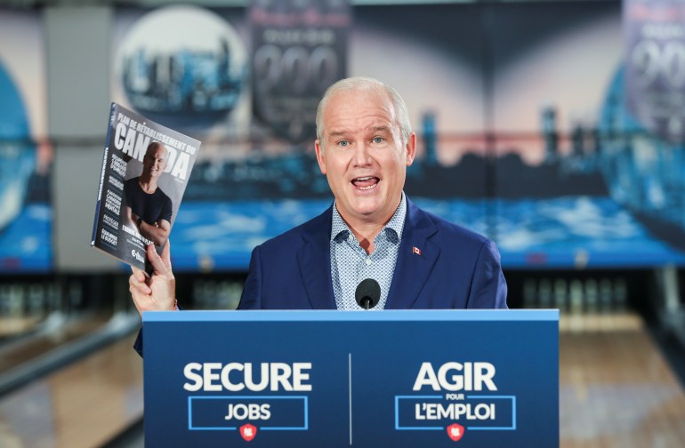 Erin O'Toole stands at a podium during the 2021 Canadian election campaign