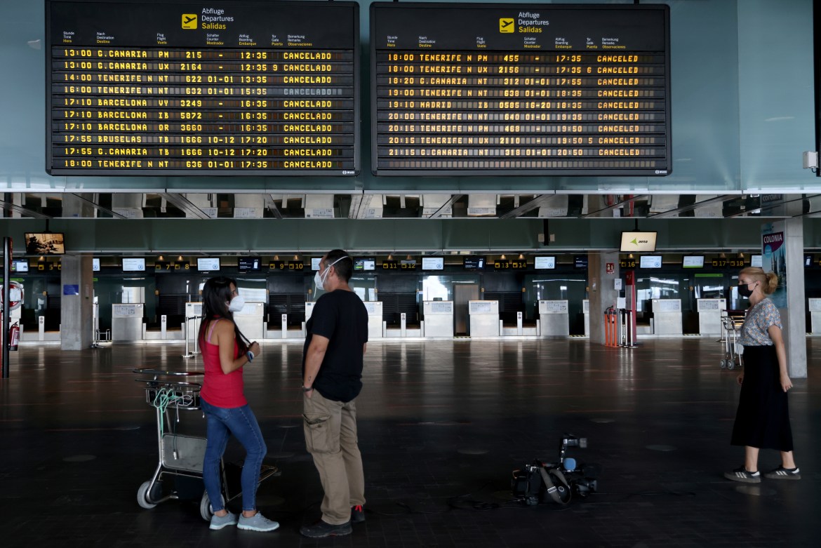 Passengers wait at the closed La Palma Airport. [Nacho Doce/Reuters]
