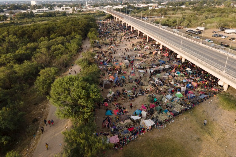 Haitians gathered under the Bridge