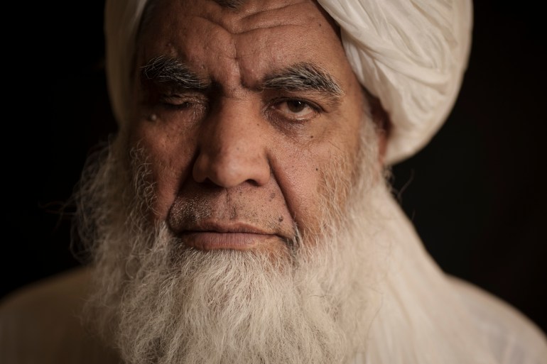 Taliban leader Mullah Nooruddin Turabi poses for a photo in Kabul, Afghanistan, Wednesday, Sept. 22, 2021