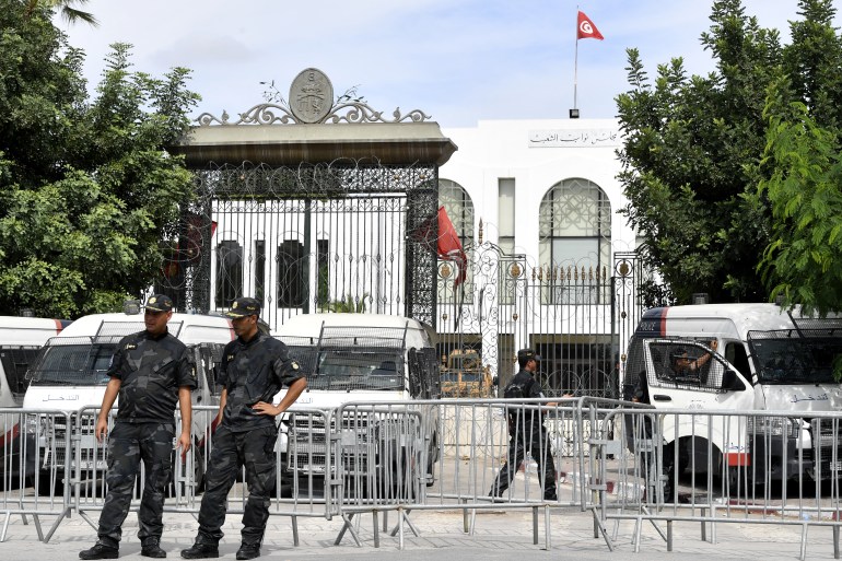 Tunisian security forces guard the entrance of the country's parliament, on October 10, 2021 [File: Fethi Belaid/AFP]