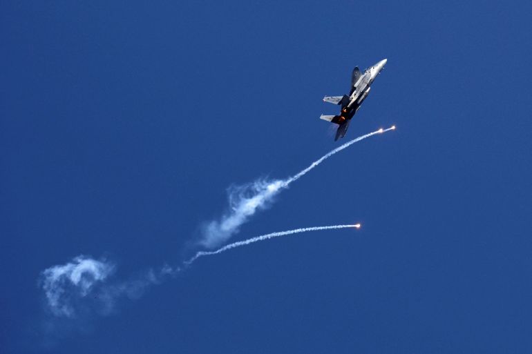 An Israeli air force F-15I fighter jet releases flares over the Mediterranean Sea during an aerial show as part of the celebrations for Israel's Independence Day marking the 70th anniversary of the creation of the state, in Tel Aviv, Israel April 19, 2018. REUTERS/Amir Cohen