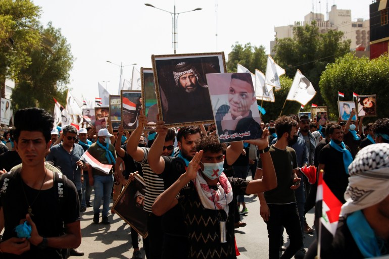 Iraqi protesters marked the second anniversary of anti-government protests in Baghdad [Saba Kareem/Reuters]