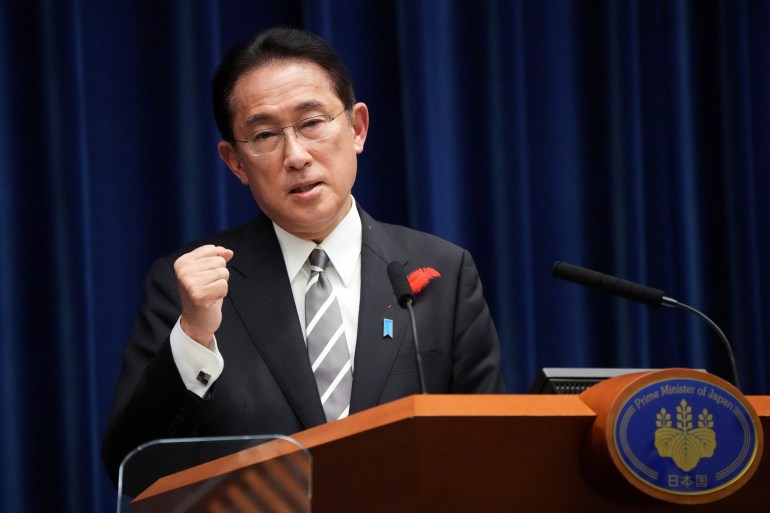 Prime Minister Fumio Kishida speaking at a lectern.