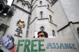 A supporter of Wikileaks founder Julian Assange protests outside the Royal Courts of Justice in London, Britain, October 27, 2021