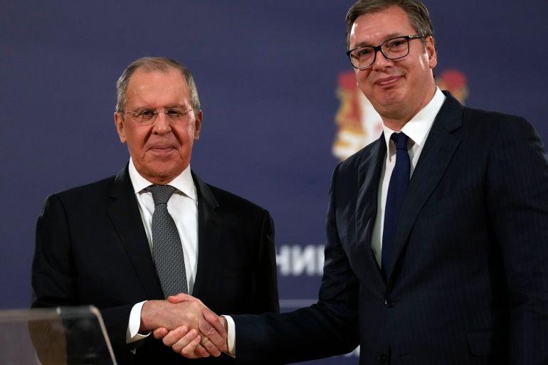 Russian Foreign Minister Sergey Lavrov, left, shakes hands with Serbia's President Aleksandar Vucic after a press conference in Belgrade, Serbia in 2021 [Darko Vojinovic/AP]