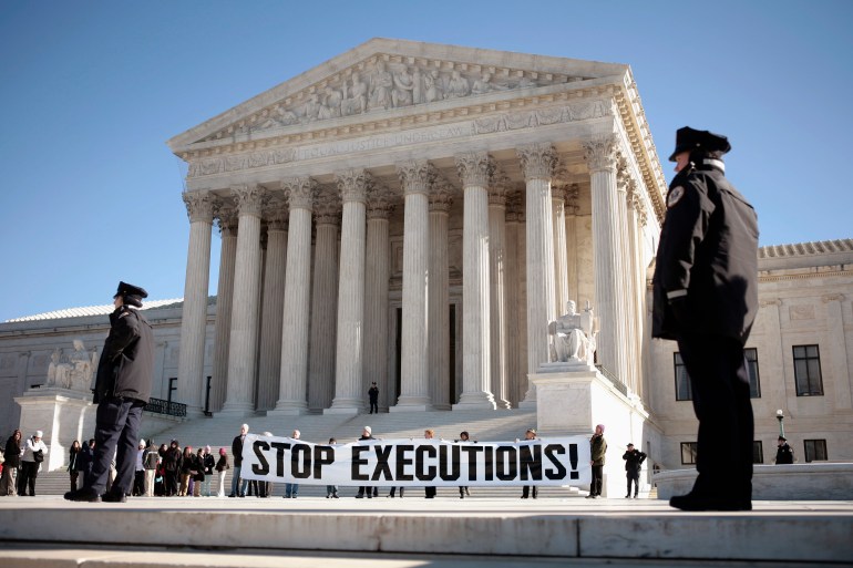 Protesters calling for an end to the death penalty unfurl a banner outside the U.S. Supreme Court in Washington in January 2007.