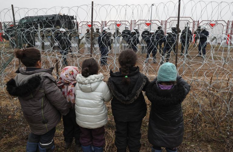 Migrants aiming near the Bruzgi-Kuznica border crossing on the Belarusian-Polish border