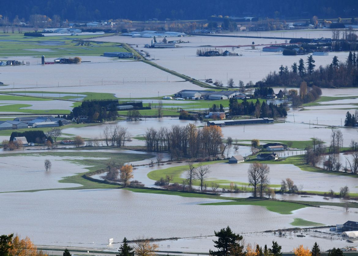 A view of flooding in the Sumas Prairie area of Abbotsford British Columbia, Canada, on November 17, 2021. (Photo by Don MacKinnon / AFP)
