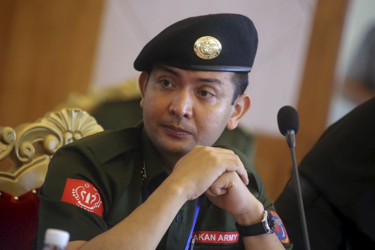 Tun Myat Naing, commander-in-chief of the Arakan Army (AA), . He is wearing a dark green uniform with a red patch on the shoulder and a green beret with a badge