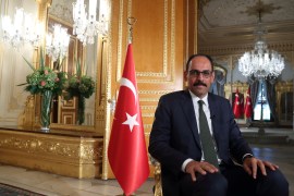 Turkish President Tayyip Erdogan's spokesman Ibrahim Kalin sitting