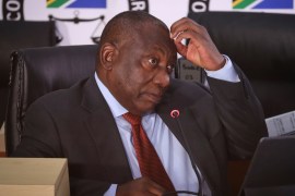 South Africa President Cyril Ramaphosa touches his head during the Zondo Commission of Inquiry into State Capture, in Johannesburg, Thursday, Aug. 12, 2021. Ramaphosa is testifying on the second day at the judicial investigation into corruption during former president Jacob Zuma's term as president