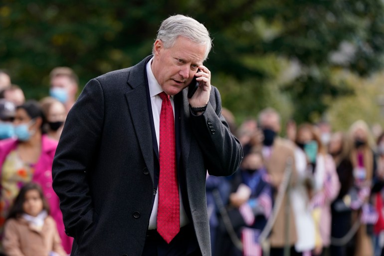  White House chief of staff Mark Meadows speaks on a phone on the South Lawn of the White House.